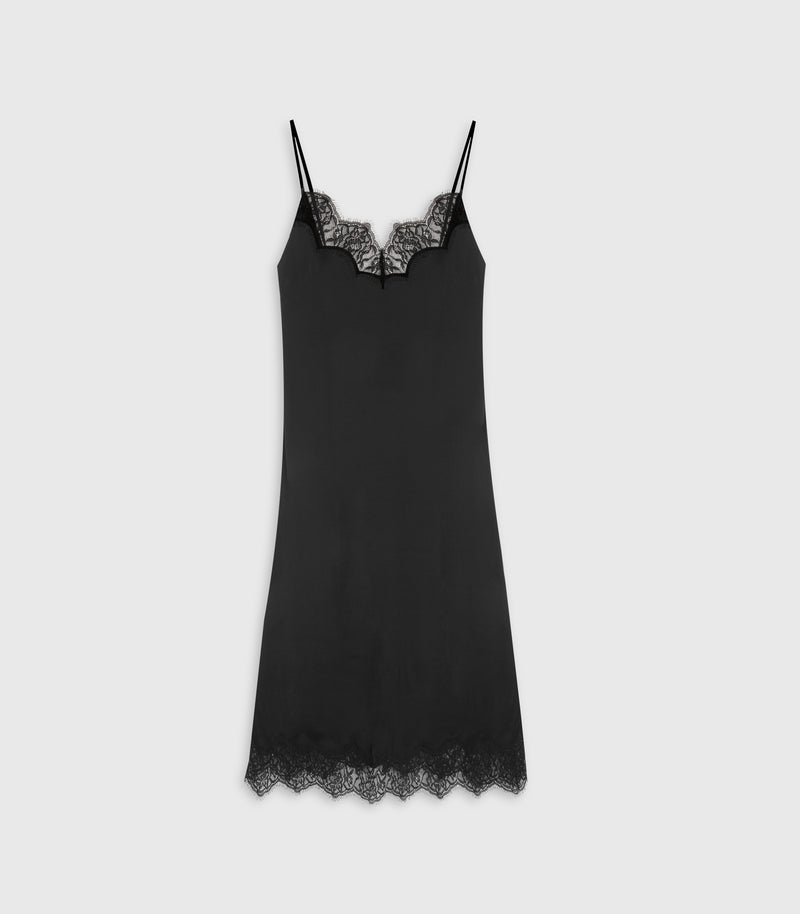 A black satin slip dress with thin spaghetti straps, a scalloped lace V-neckline, and a matching lace hem, displayed against a light gray background.