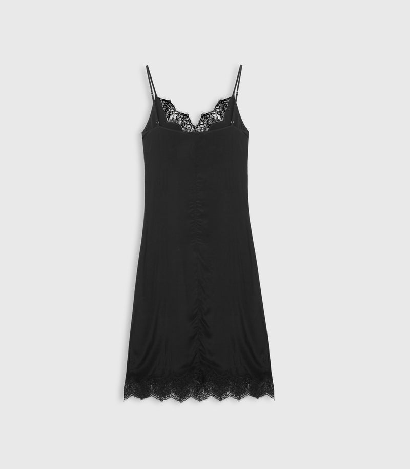 A black slip dress with thin spaghetti straps, a lace-trimmed sweetheart neckline, a lace hem, and a gathered ruched front, shown against a light gray background.