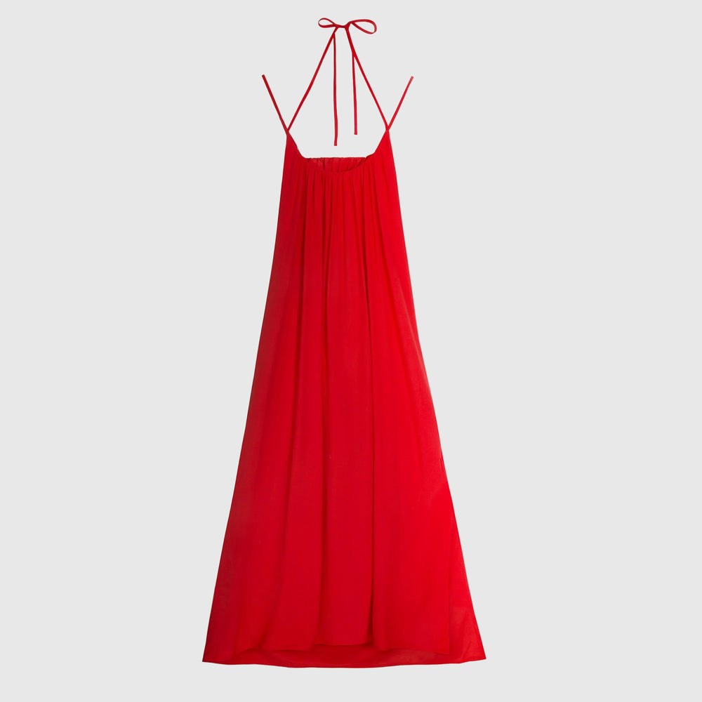 A bright red halter-neck maxi dress with thin adjustable tie straps, shown against a plain white background.