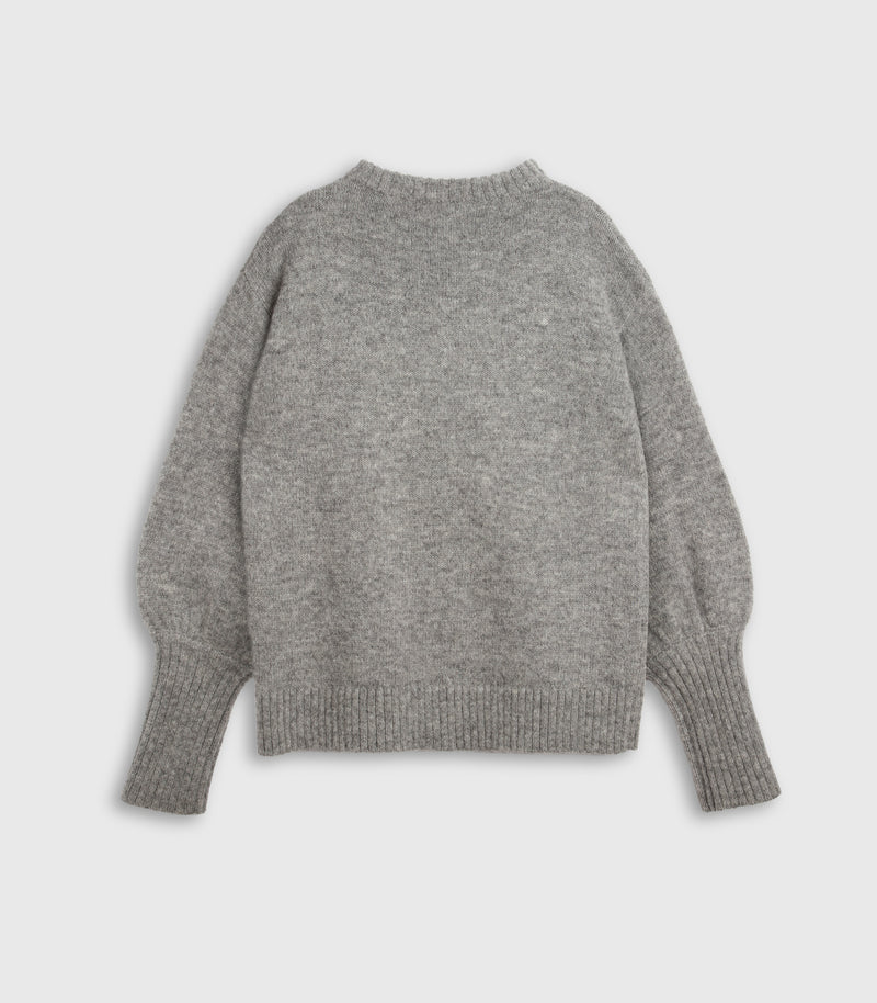 A light gray knit sweater with balloon sleeves, shown from the back against a light gray background.