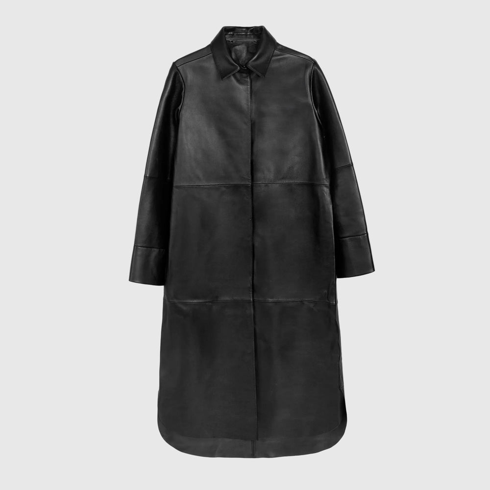 A black leather longline shirt coat with a pointed collar and button closure, displayed on a clean white background.