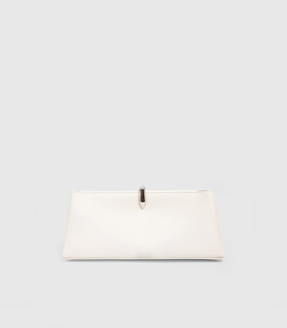 A cream-colored leather clutch bag with a small metallic silver clasp, displayed against a solid light gray background.