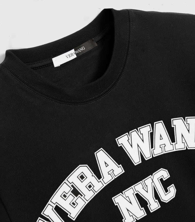 A closer shot of a black t-shirt with 'VERA WANG NYC' spell-out logo across the chest, against a white background.