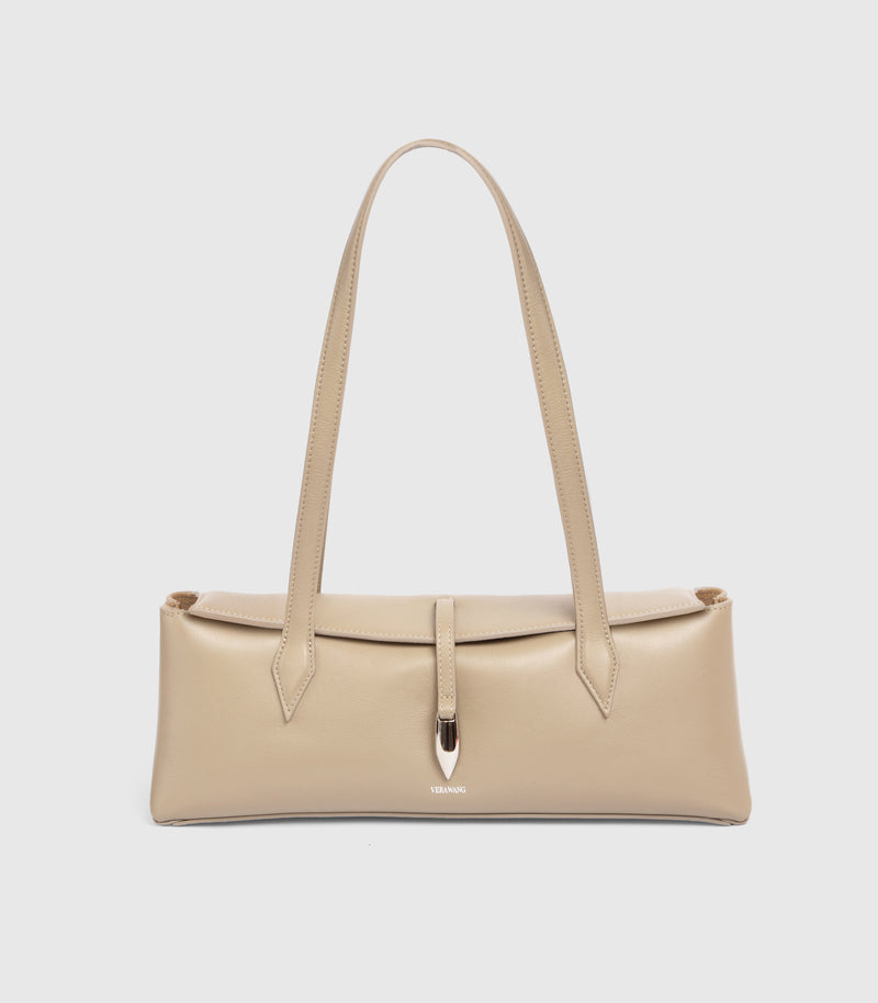 A structured beige leather shoulder bag with long double straps and a central strap detail secured by a metallic silver clasp, shown against a light gray background.
