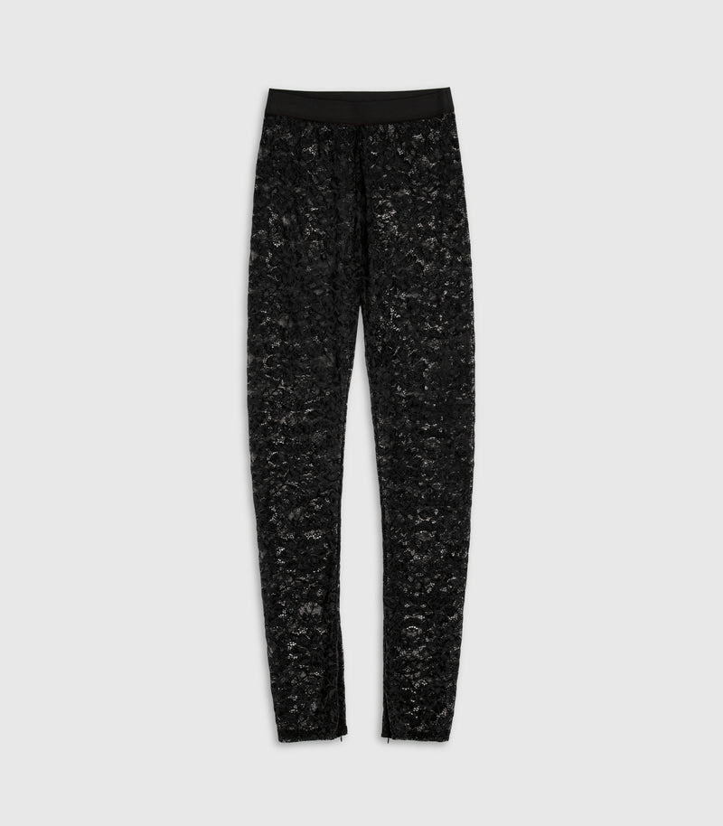 A front flat-lay view of the Frances black sheer floral lace leggings by Vera Wang, featuring a smooth, solid black elastic waistband and tapered legs with subtle ankle cuff details. The product is photographed flat against a solid light gray studio backdrop.