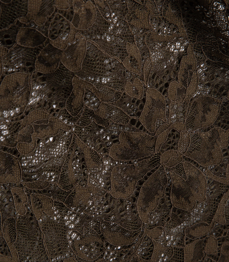 Close-up of dark brown floral lace fabric with a textured mesh.