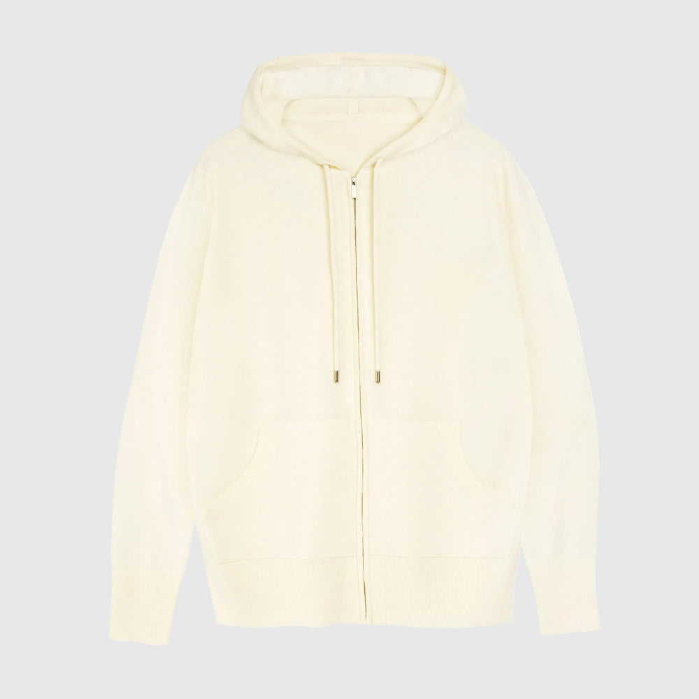 A cream-colored zip-up hoodie with a drawstring hood and front pockets, shown flat against a plain white background.