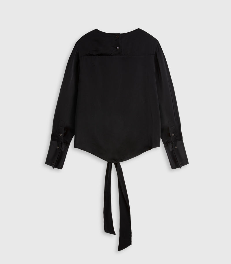 A black long-sleeve blouse with a draped, asymmetrical front design, buttoned cuffs, and a long tie belt at the hem, displayed against a light gray background.