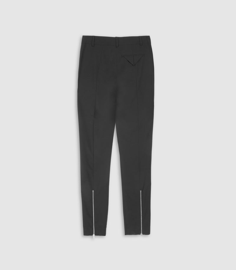 Navy blue leggings on a beige background