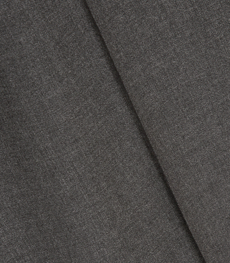 A close-up of dark gray textured fabric with a diagonal fold showing the material's fine woven pattern.