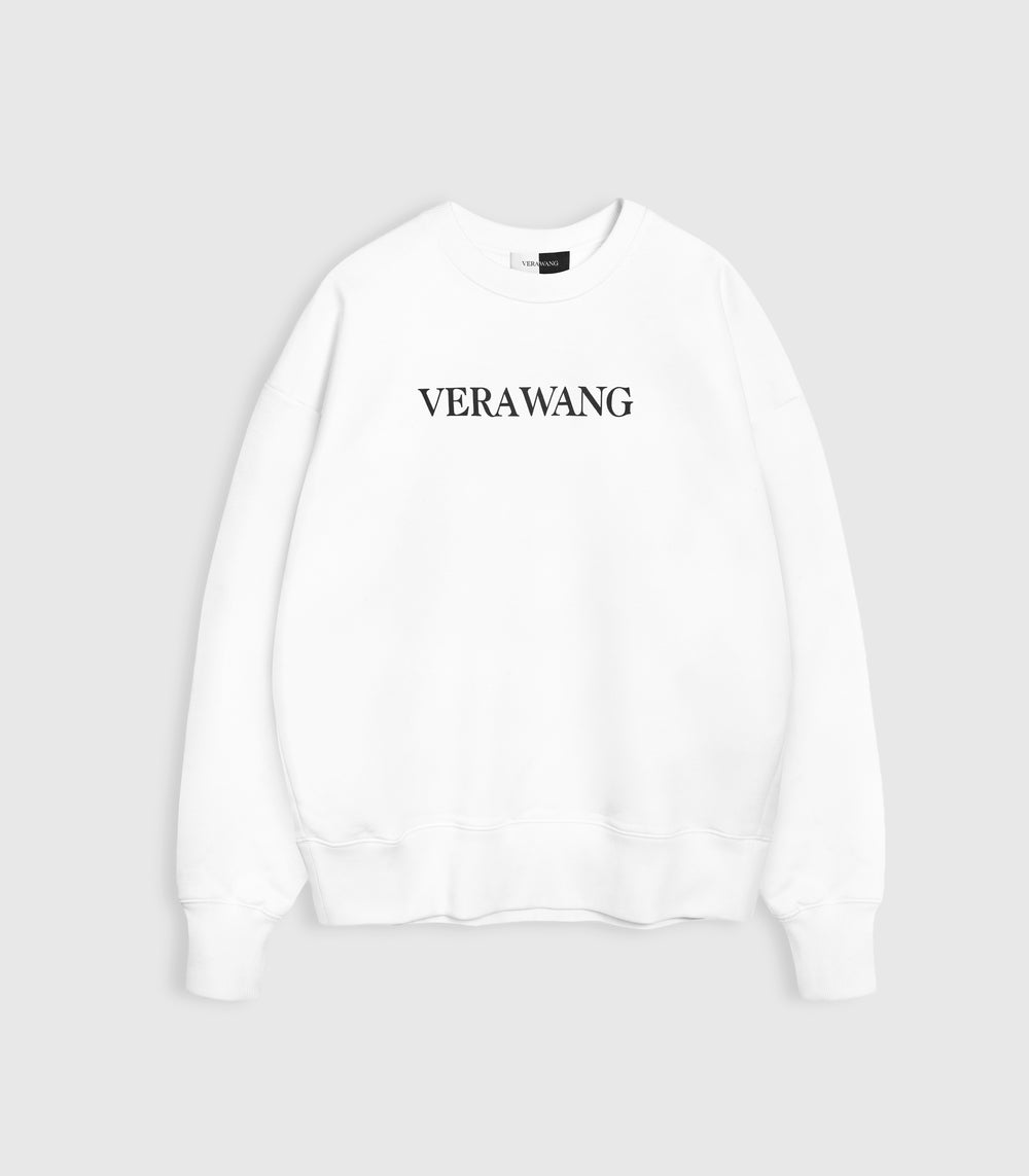 A white crewneck sweatshirt with a black 'VERA WANG' spell-out logo across the chest, against a white background.