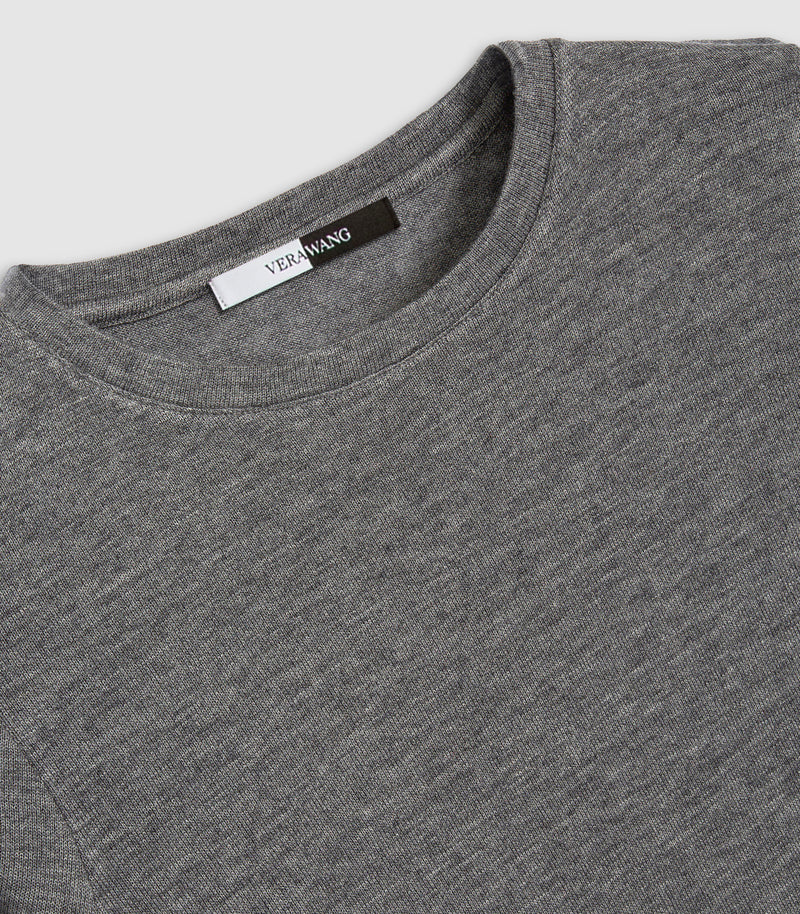 Close-up of a heather gray crewneck t-shirt showing the inner collar label with the brand name 'VERAWING'.