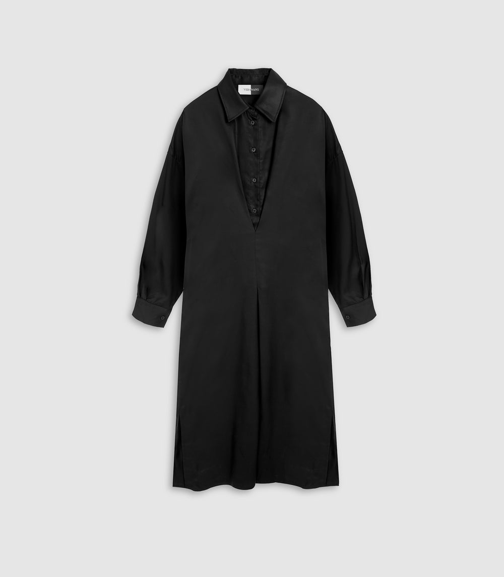 A black long-sleeve shirt dress with a pointed collar and button-front placket, shown flat against a light gray background.