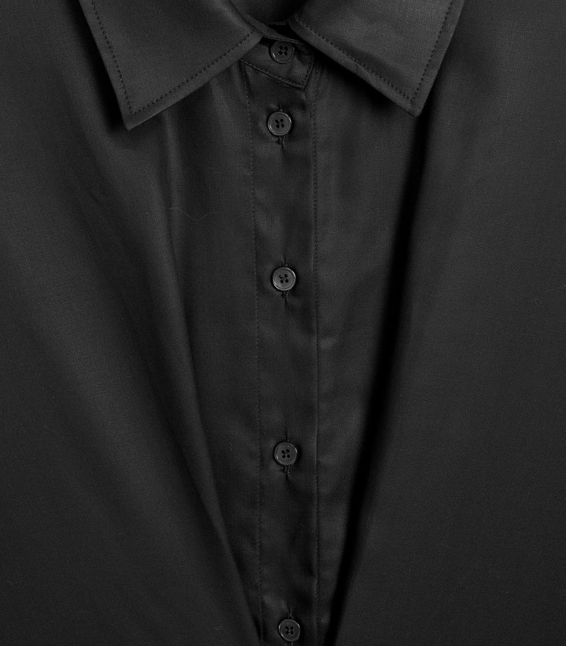 Close-up of a black button-down shirt collar and front placket, showing dark buttons and subtle fabric sheen.