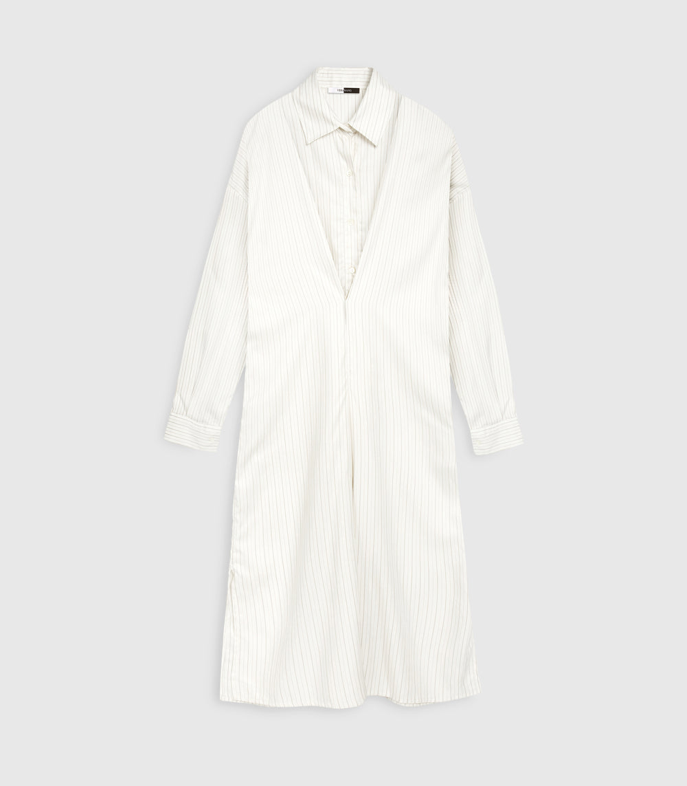 Flat lay front product view of an ivory-beige midi shirt dress in a fine vertical pinstripe pattern. The construction displays a traditional pointed collar, dropped shoulder seams, and long sleeves with structured cuffs, layered beneath an integrated front wrap overlay that creates a deep V-shaped structural fold and draped midi skirt, set against a seamless light grey backdrop.