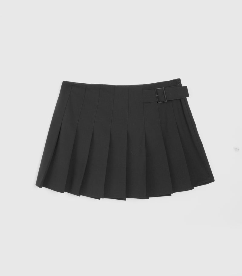 Black pleated skirt with a black waist side buckle, against a white studio background