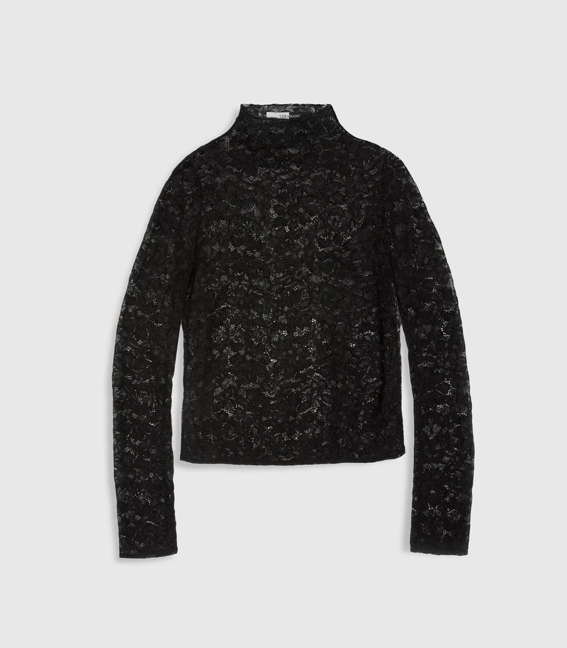 Flat lay product view of a long-sleeved black polo neck top crafted from an all-over, sheer floral lace. The layout highlights the high mock collar neckline, long slim sleeves, and a straight hemline, with a subtle split black-and-white inner neck 'VERA WANG' brand label peeking through the translucent textile against a light grey background.
