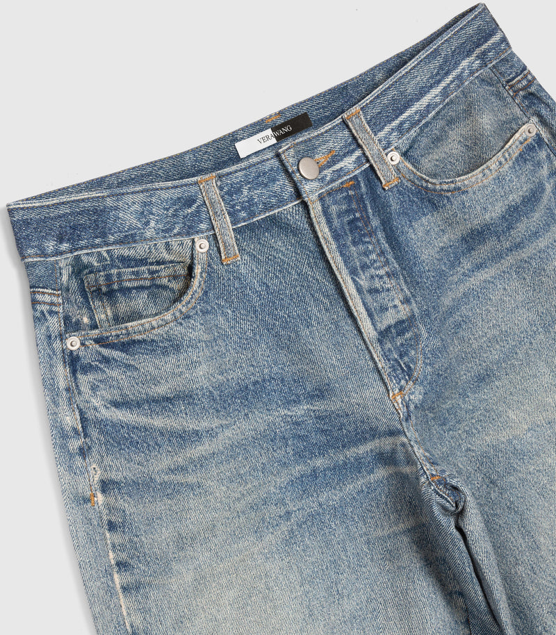 Close-up of a pair of light blue denim jeans showing the waistband, belt loops, front pockets, and rivets on a light gray background.