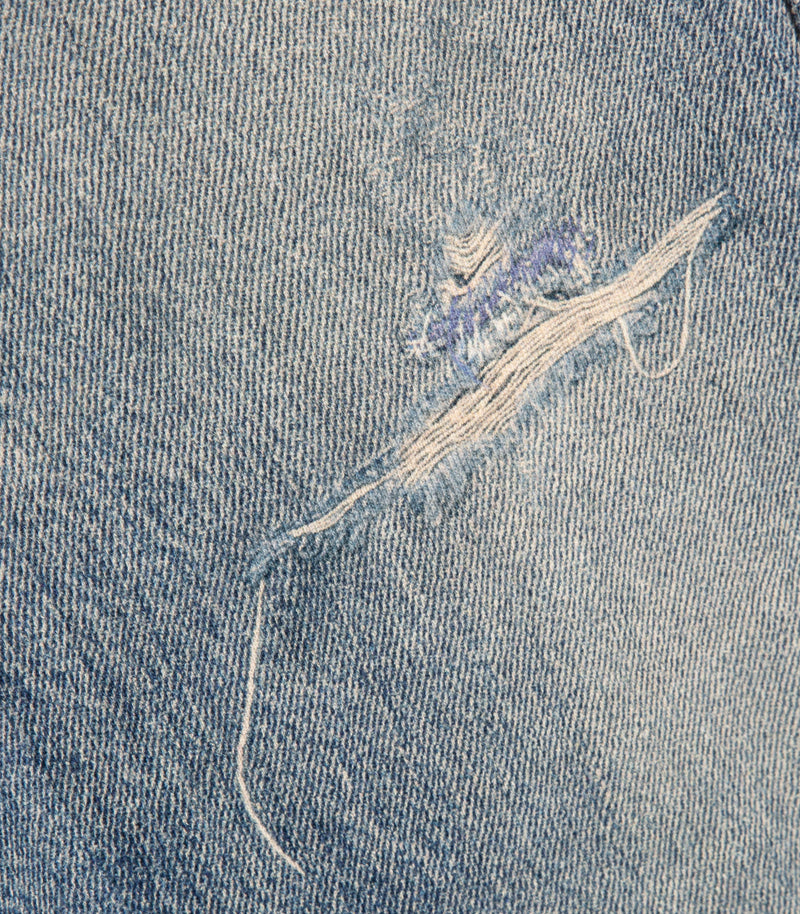 A close-up of the distressed detail on the Saskia Straight Leg Lounge Pant by Vera Wang
