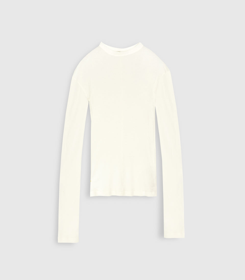 An ivory white sheer jersey long-sleeve top from Vera Wang, featuring a high crew neckline and extra-long sleeves. The lightweight knit shirt is photographed flat against a solid light gray studio background.