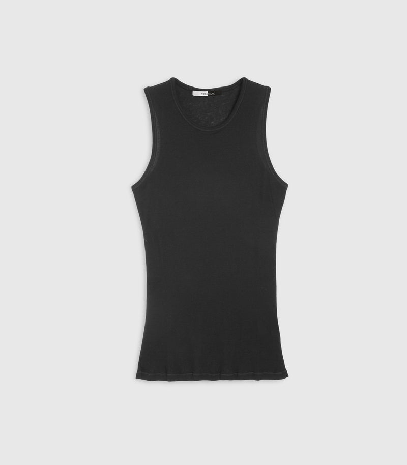 Flat lay product view of a fitted black tank top featuring a fine vertical ribbed knit texture, a high-cut crew neckline, and deeply curved, athletic-style sleeveless cut-outs. The top is displayed flat, showing a visible split black-and-white inner neck brand label against a light grey background.