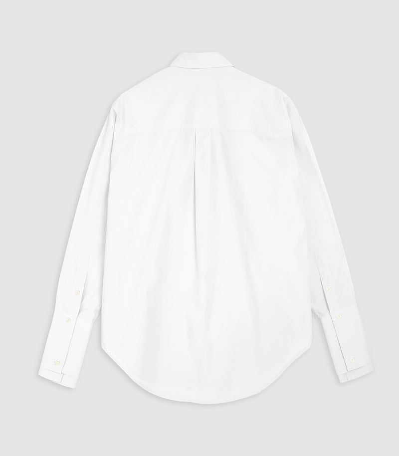 A white long-sleeve button-down shirt shown from the back, laid flat against a light gray background.