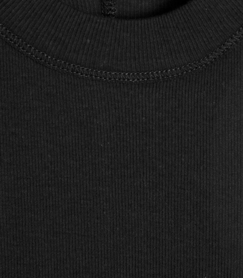 Macro close-up product view of a black tank top, showcasing the fine vertical ribbed knit texture of the fabric, a thick ribbed crew neckline, and precise tonal coverstitch detailing along the collar seam.