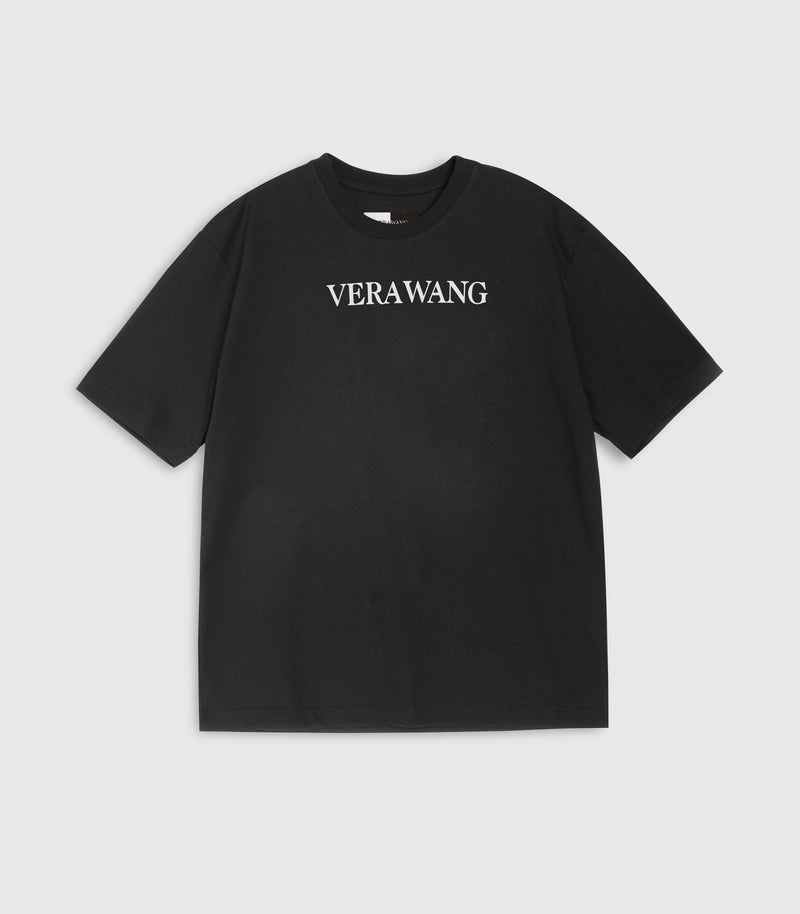 Flat lay view of a loose-fit black crewneck t-shirt featuring 'VERA WANG' logo in bold white text across the chest, displayed against a white background.