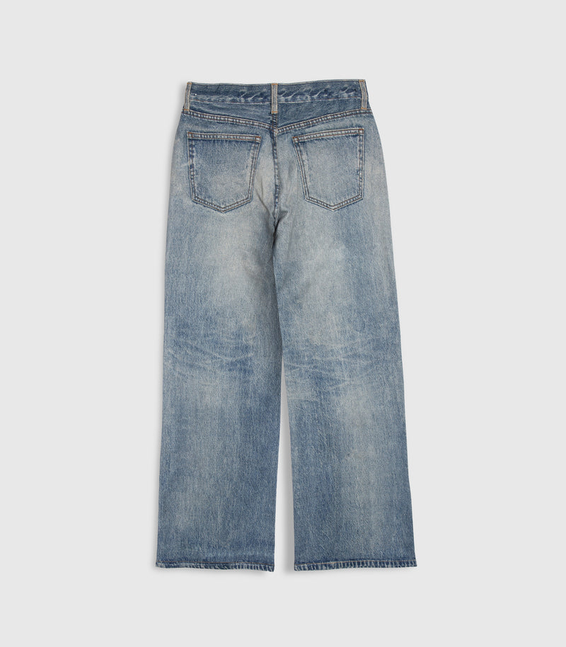A pair of light blue denim jeans shown from the back, featuring a straight-to-wide leg fit and a heavily faded wash, photographed against a neutral light gray background.