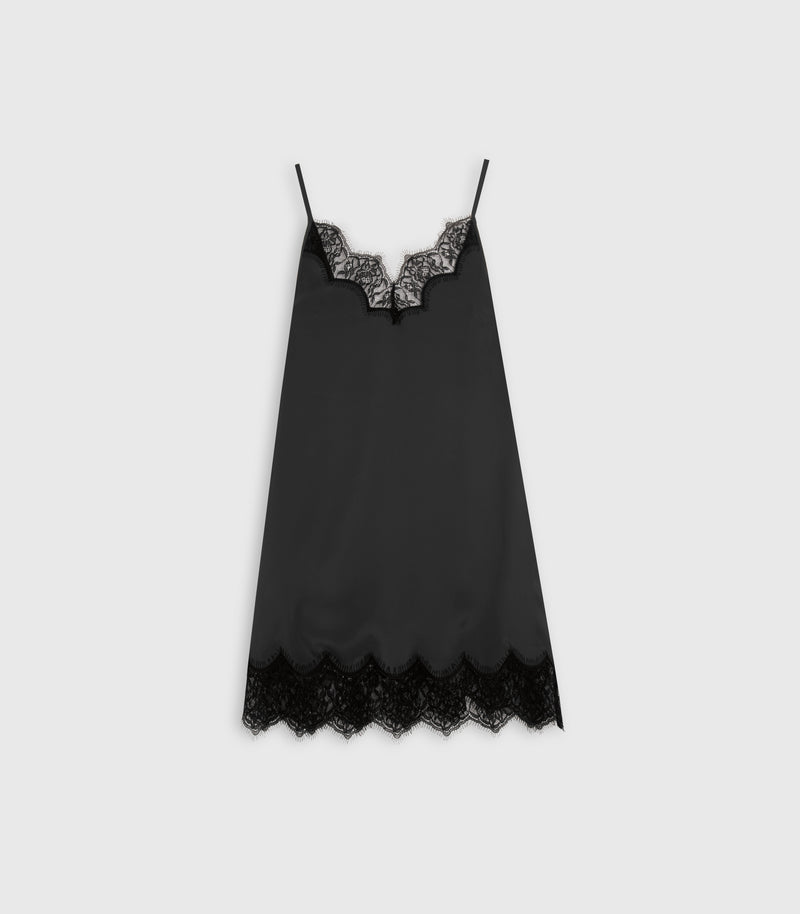 A black satin chemise slip with delicate black lace trim at the scoop neckline and hem, displayed flat against a light gray background.