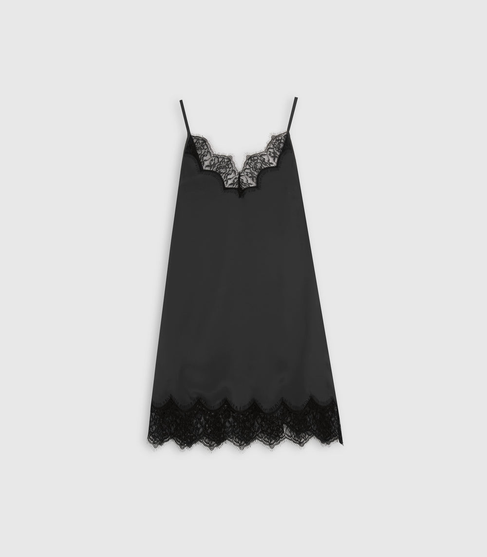 A black satin chemise slip with delicate black lace trim at the scoop neckline and hem, displayed flat against a light gray background.
