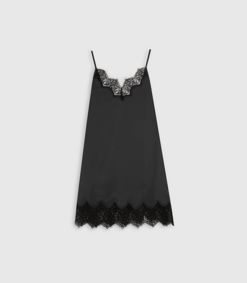 A black satin chemise slip with delicate black lace trim at the scoop neckline and hem, displayed flat against a light gray background.