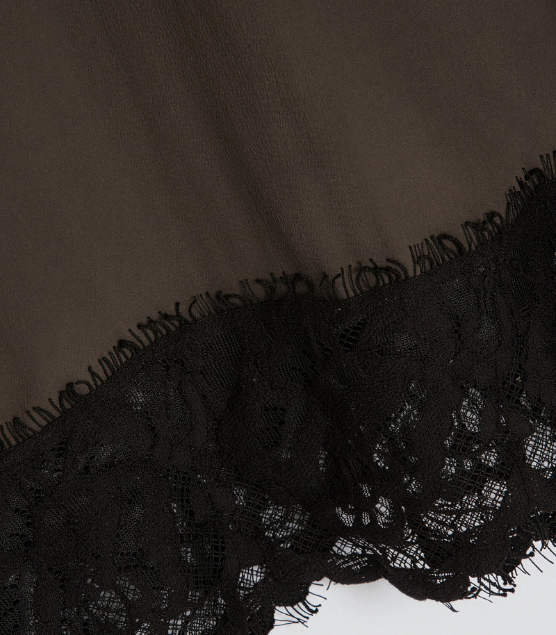 Displays a model wearing the Sibel Turkish Coffee 'Vera Wang' branded Lace Slip Dress featuring the close up on the details 