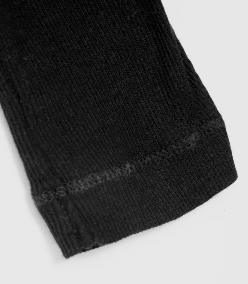 Displays the Sheer Black 'Vera Wang' branded long sleeve top featuring the close up on the details 