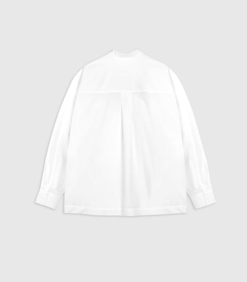 A white long-sleeve blouse with a high mock neck and a subtle horizontal seam detail across the upper chest, displayed flat against a light gray background.