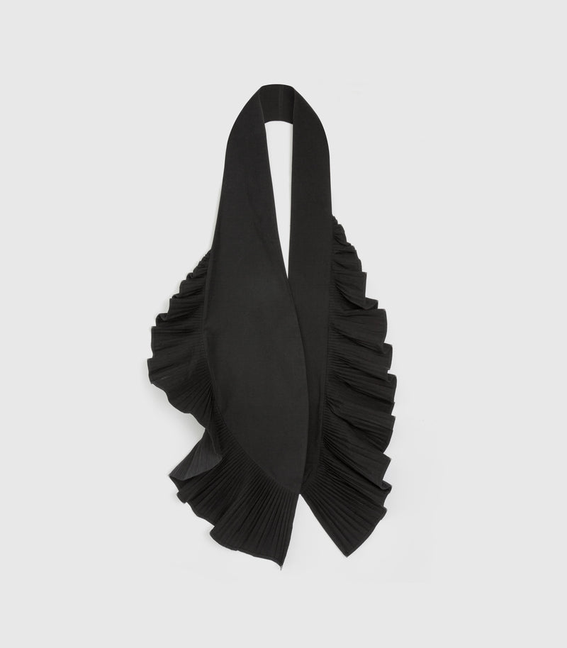 A black pleated wrap scarf with dramatic cascading ruffles, displayed against a solid light gray background.