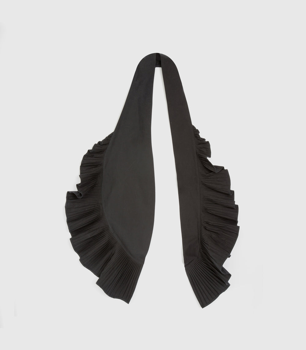 A black scarf with dramatic pleated ruffle trim on both ends, displayed flat against a light gray background.