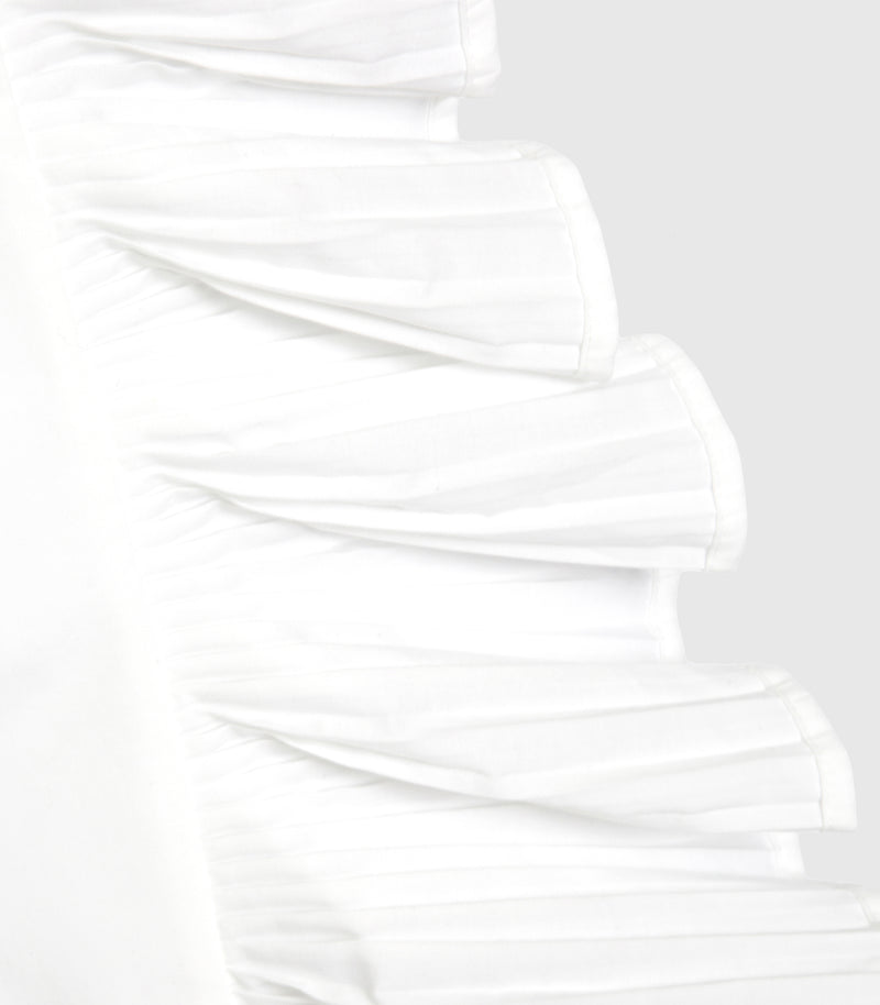 Close-up of a white pleated or ruffled scarf against a light gray background.